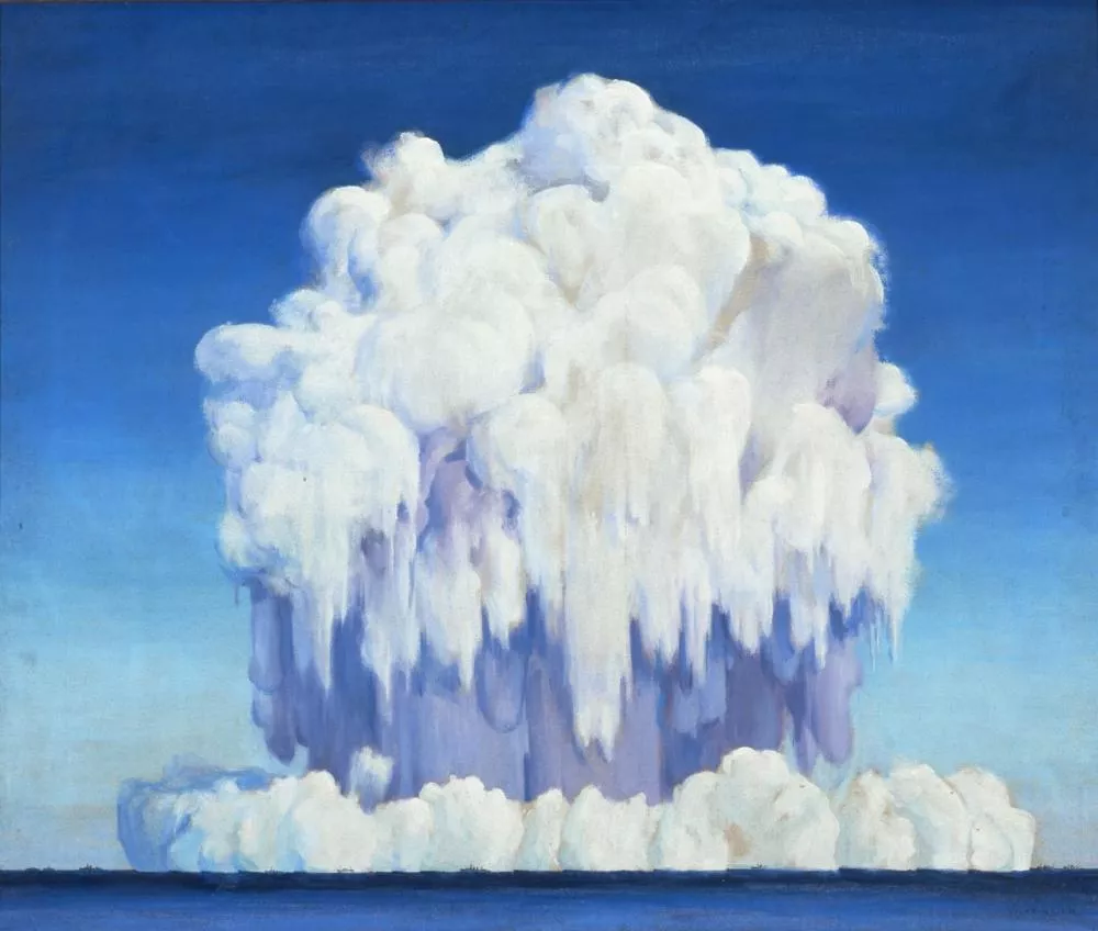 L'image montre un immense nuage blanc en forme de champignon s'élevant au-dessus d'une étendue d'eau, sous un ciel bleu.