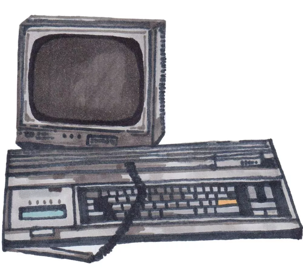 Un ordinateur vintage avec un écran cathodique et un clavier intégré.