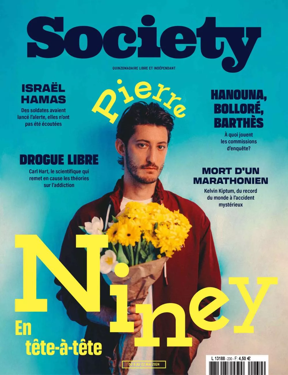 C'est la couverture du magazine "Society" avec une photo de Pierre Niney tenant un bouquet de fleurs jaunes. Les titres mentionnent divers sujets : Israël et Hamas, drogue libre avec Carl Hart, Hanouna, Bolloré, Barthès, et la mort d'un marathonien, Kelvin Kiptum.
