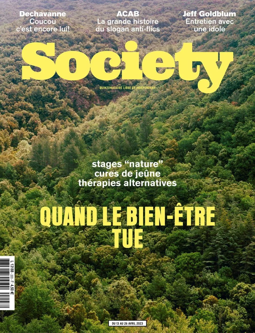 La couverture du magazine "Society" présente un paysage forestier avec des titres d'articles sur Dechavanne, le slogan ACAB, Jeff Goldblum, et un dossier sur les dangers des pratiques de bien-être telles que les stages "nature", les cures de jeûne et les thérapies alternatives. Le numéro est daté du 13 au 26 avril 2023.