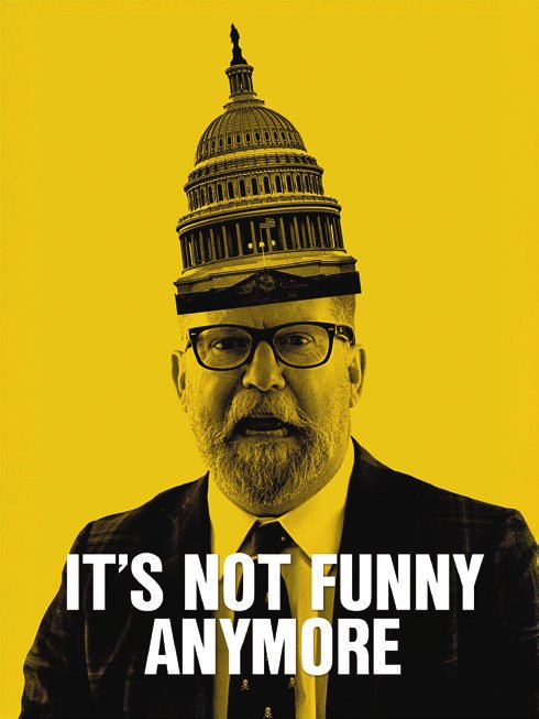 Un homme barbu portant des lunettes est représenté avec le dôme du Capitole des États-Unis comme chapeau. En bas de l'image, il y a le texte "IT'S NOT FUNNY ANYMORE" sur un fond jaune.